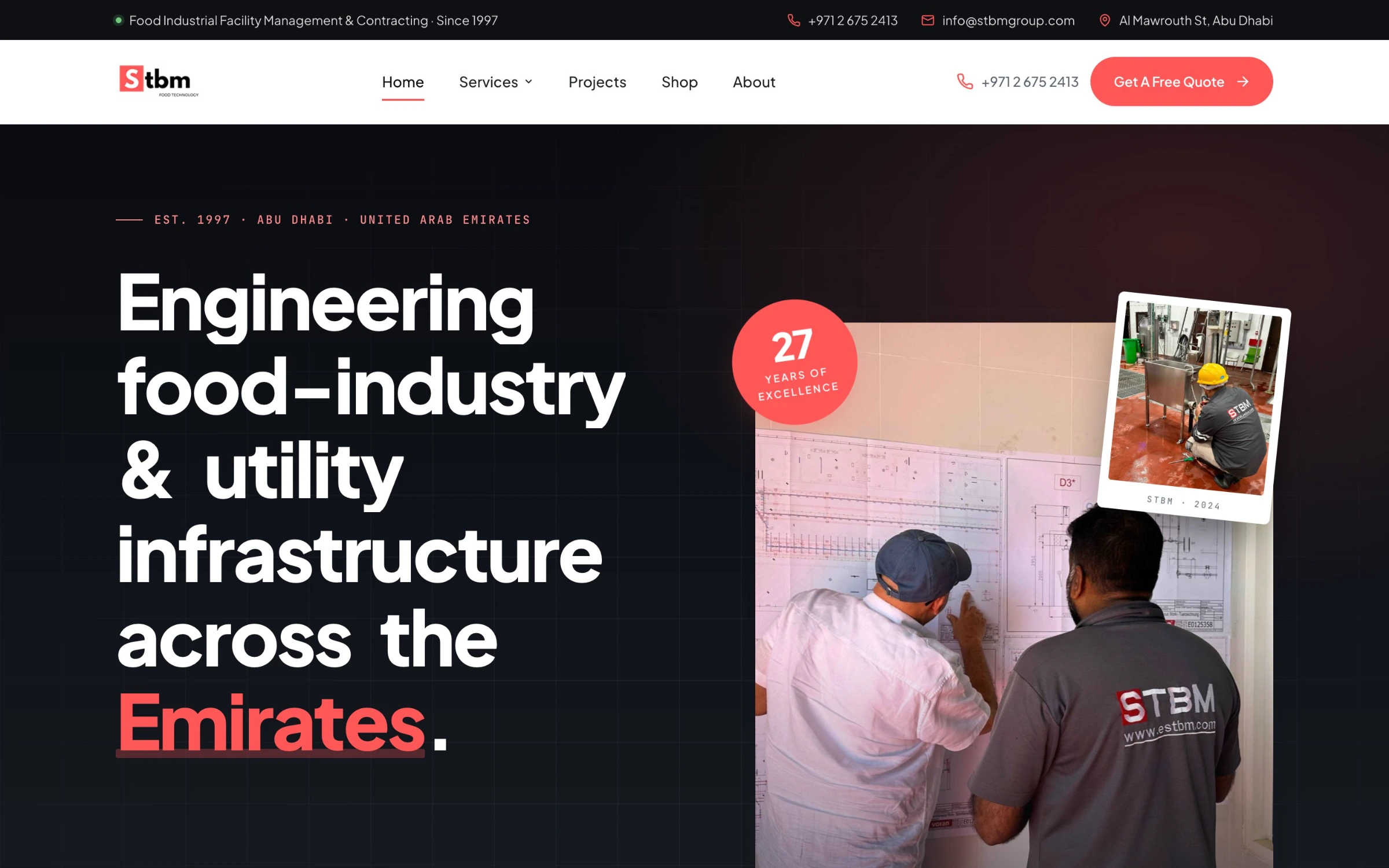 The STBM Group homepage, a dark hero over a photograph of a delivered facility.